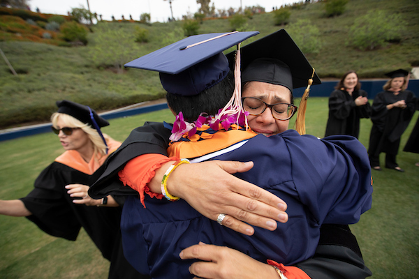 Commencement faculty and staff celebrating